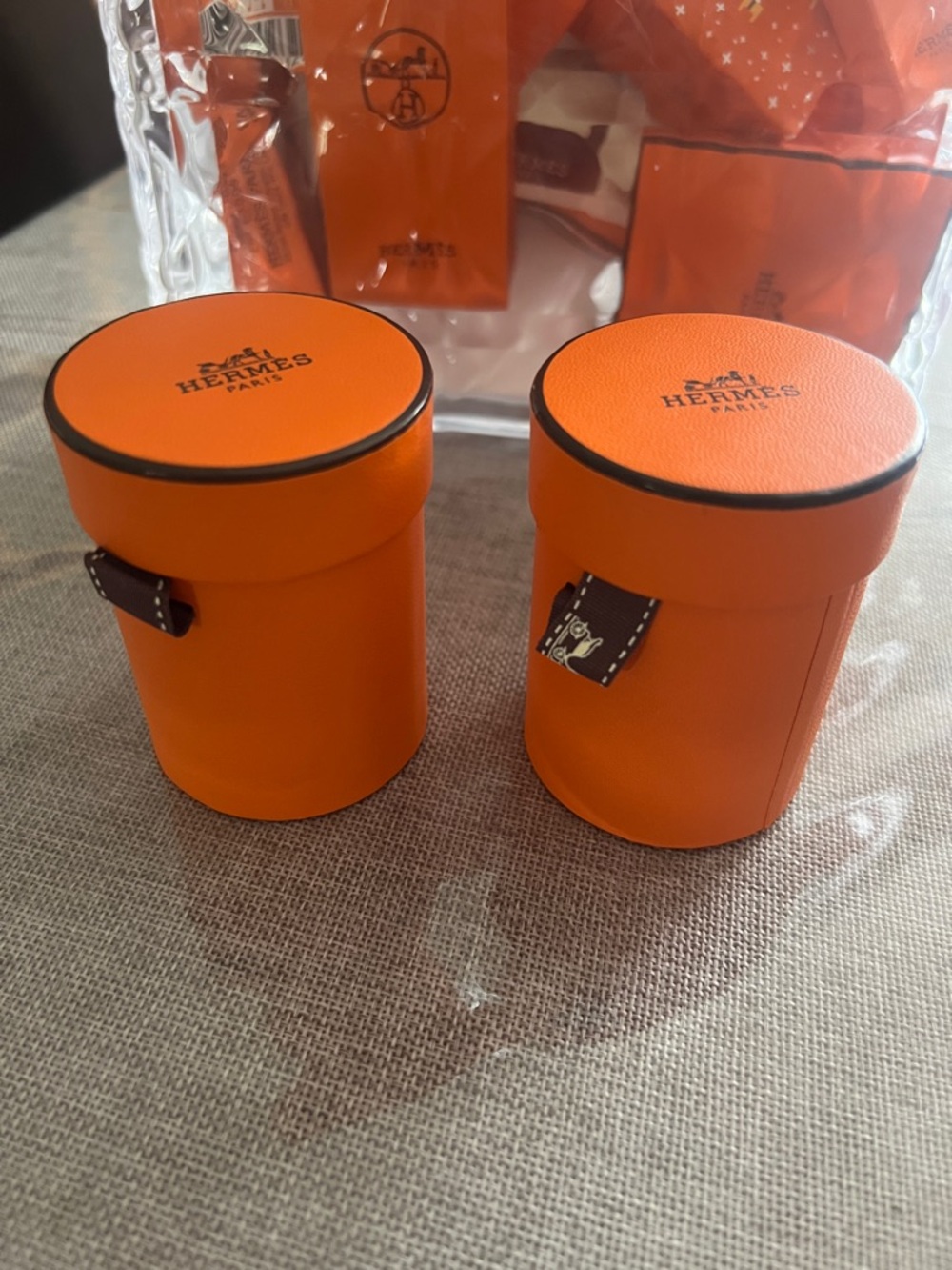 Hermes Orange Leather Cylindrical Cases - Set of 2. Store Hermes Twillies.